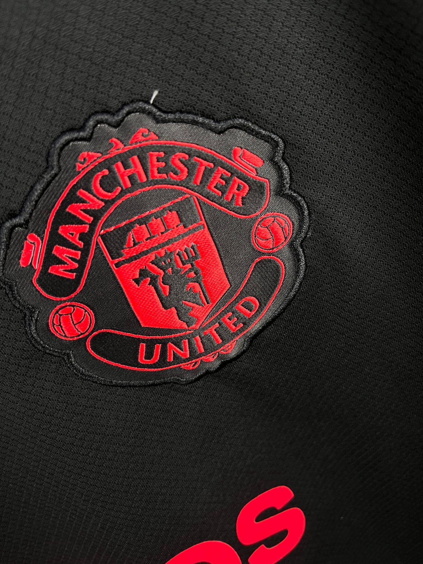 MANCHESTER UNITED TEZOS BLACK TRAINING KIT